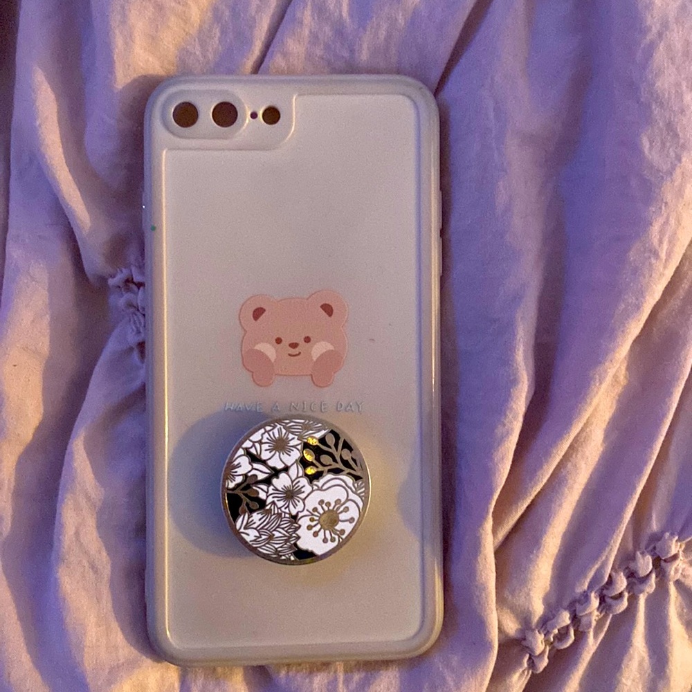 This is a phone case for a iPhone 8+ with pop socket.